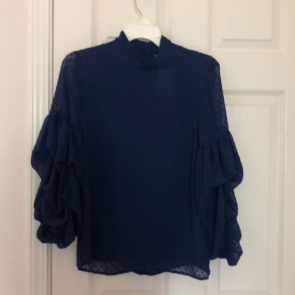 Navy blouse with ruffle arms and button detail